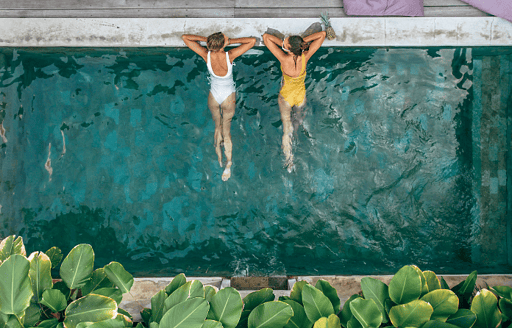 two girls swimming in a pool