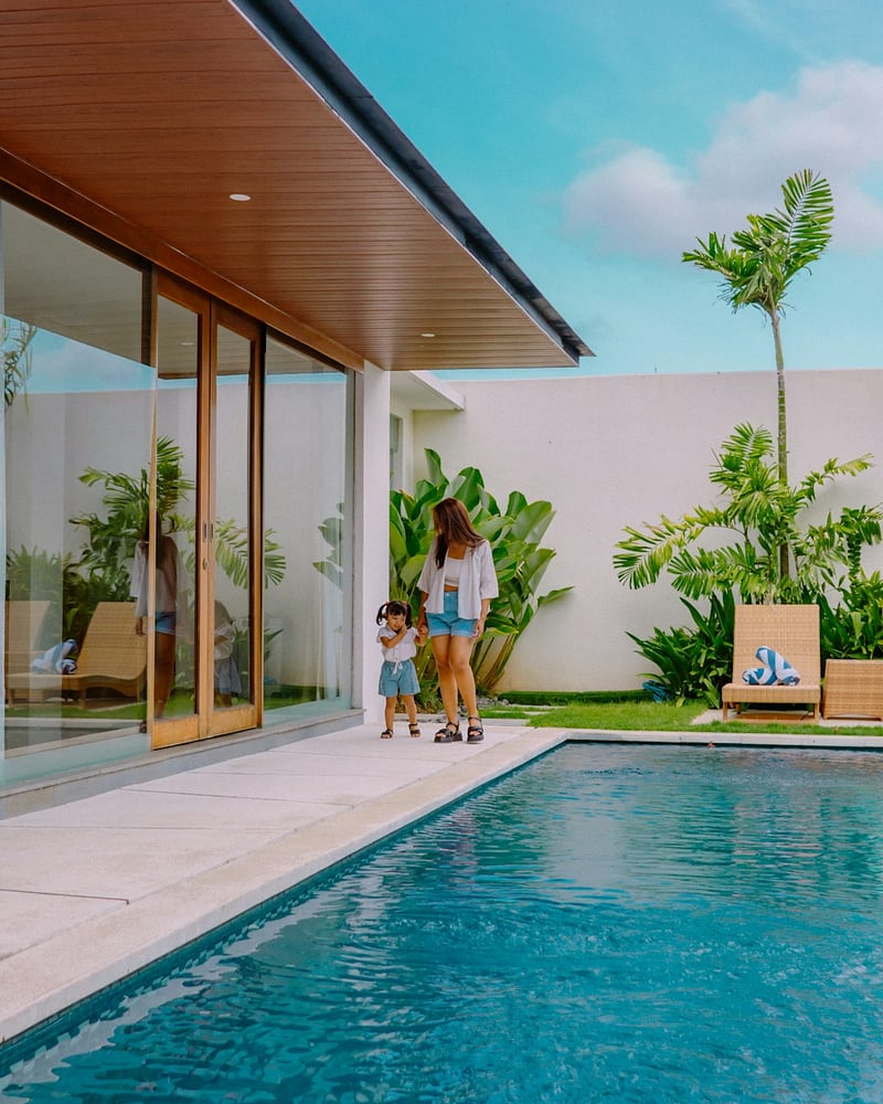 A happy family enjoying their vacation stay at a luxury villa in Bali managed by our comprehensive Villa Management Bali services.