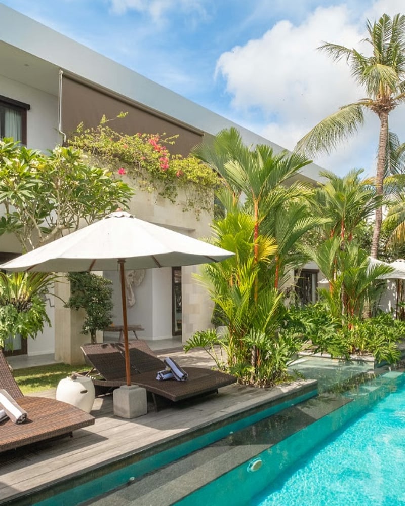 Well-maintained pool deck and relaxation area at a high-end Bali rental property, overseen by professional Bali Property Management experts.